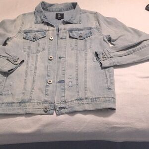 Jeans jacket like new but looks worn from unique worn areas from manufacture.